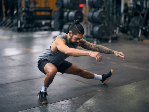 Male athlete performing mobility exercises for improved functional health