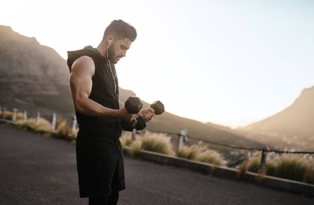 Man performing strength training as part of a peak performance program for men