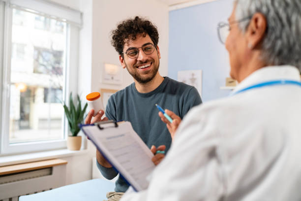 Doctor explaining cholesterol testing for men results during consultation