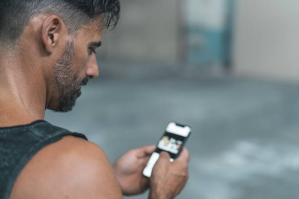Man using a fitness app to join a weekly health coaching Q&A session