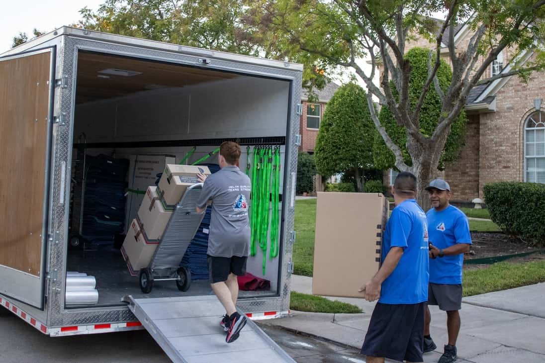 Image showing Texas Delta Crew loading boxes to trailer for Frisco Moving residents