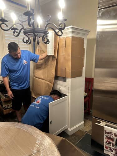 Texas Delta Moving team carefully wrapping and preparing furniture for safe transport during a residential move in Texas.