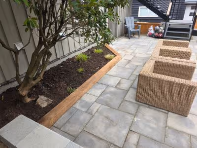 garden bed edged by 6x6 wood planks from a different angle