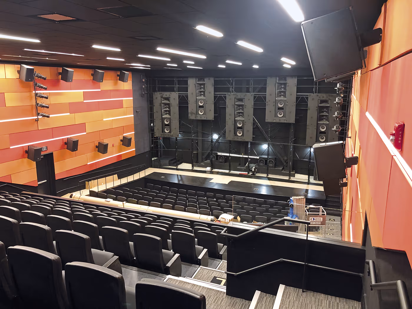 Professional auditorium with projection screen and audio system
