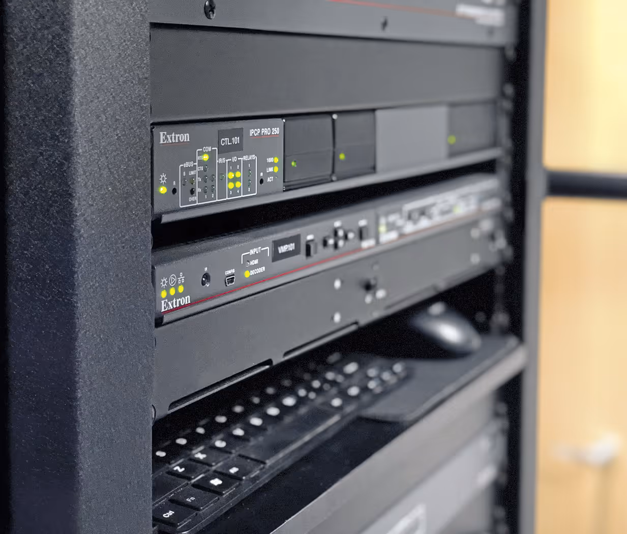 Close-up of AV rack showing signal processing and distribution hardware
