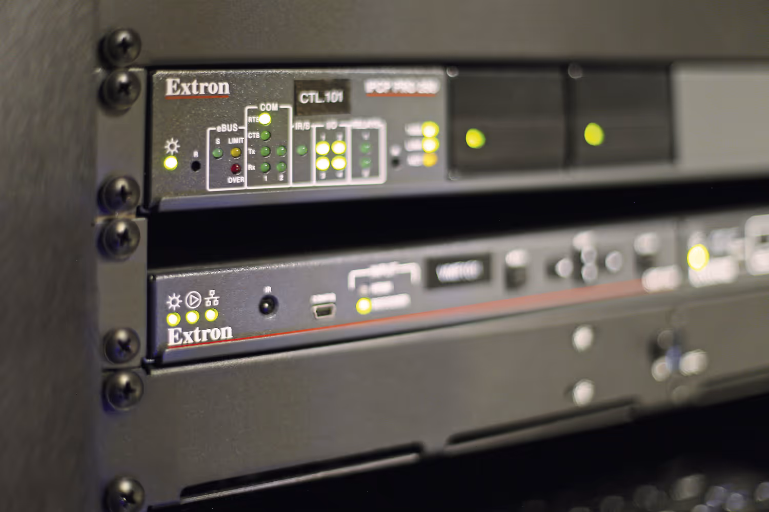 Rack-mounted Extron control system components configured for multi-zone AV routing