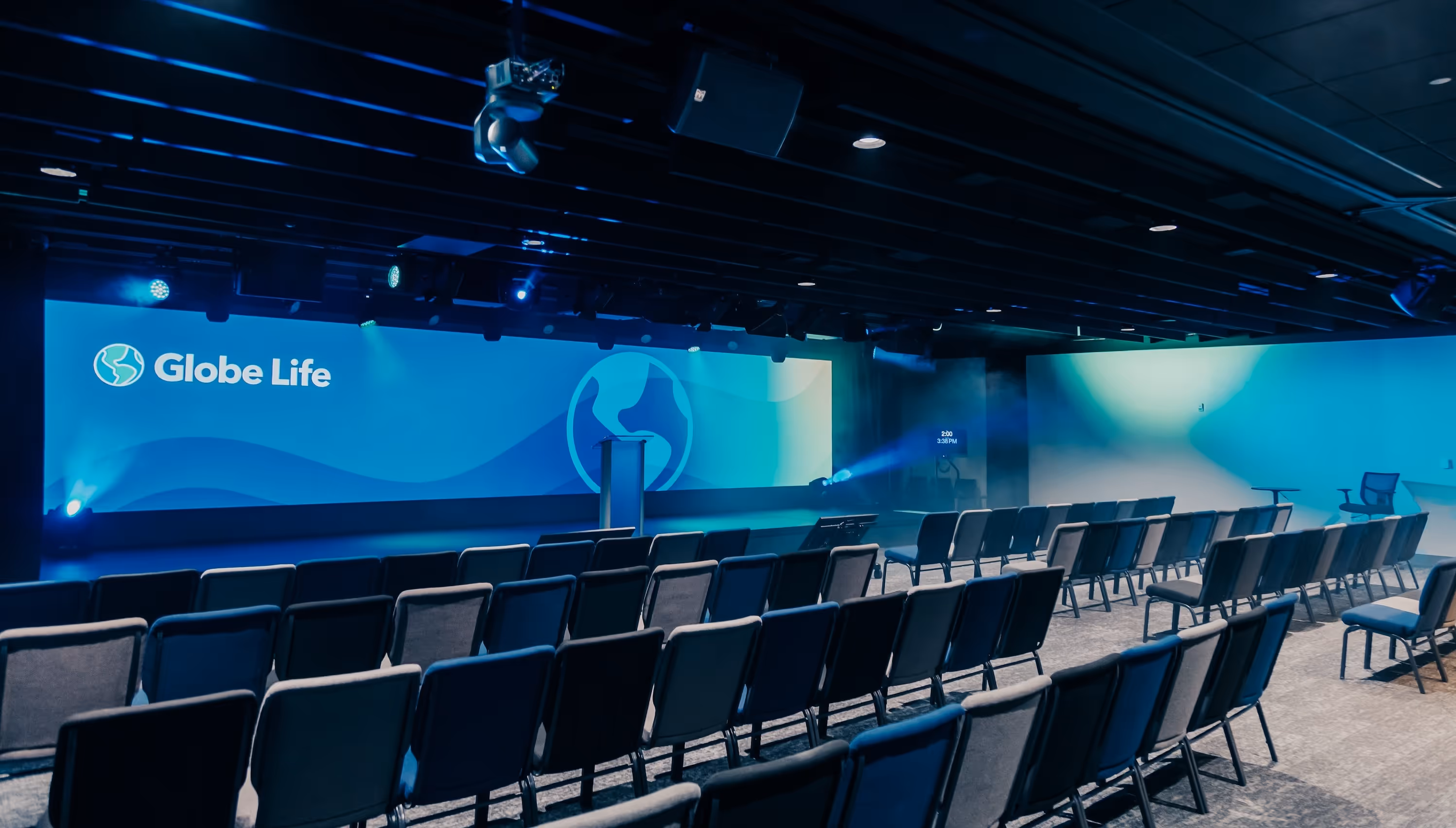 Corporate presentation room with large projection screen and professional AV system