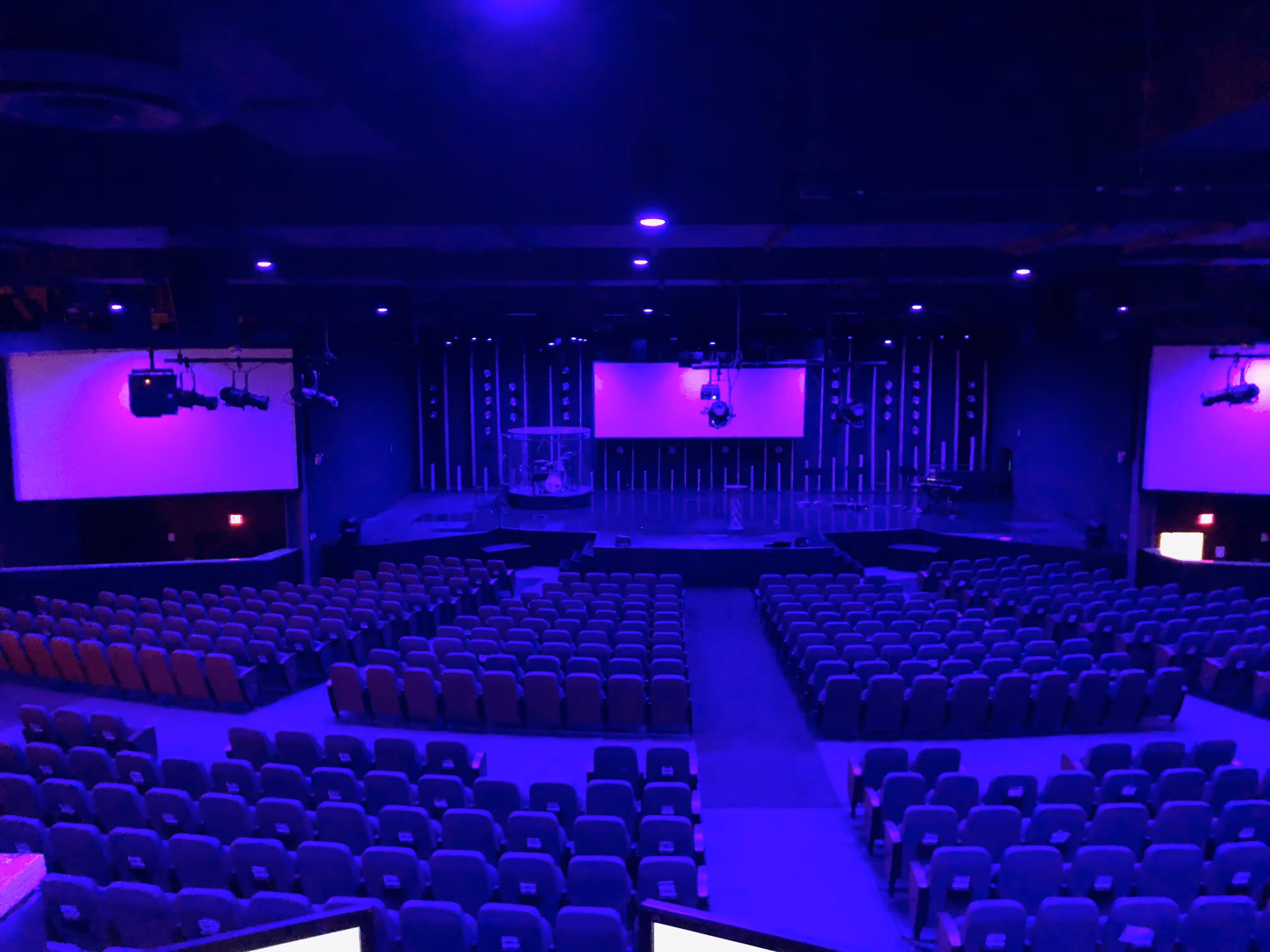 Large church worship center with LED stage lighting and AV projection