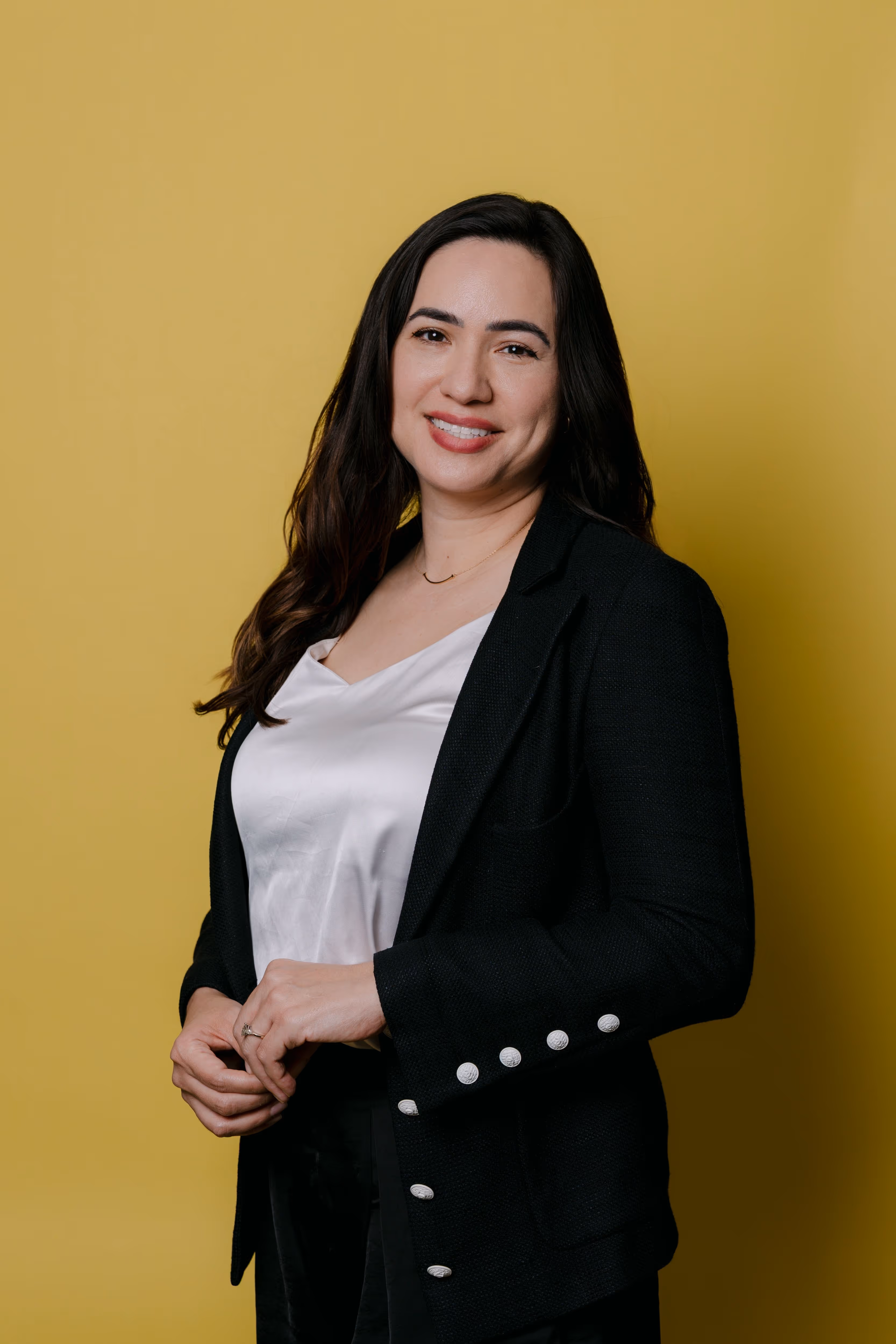 Smiling customer headshot for testimonial, professional portrait on a neutral background