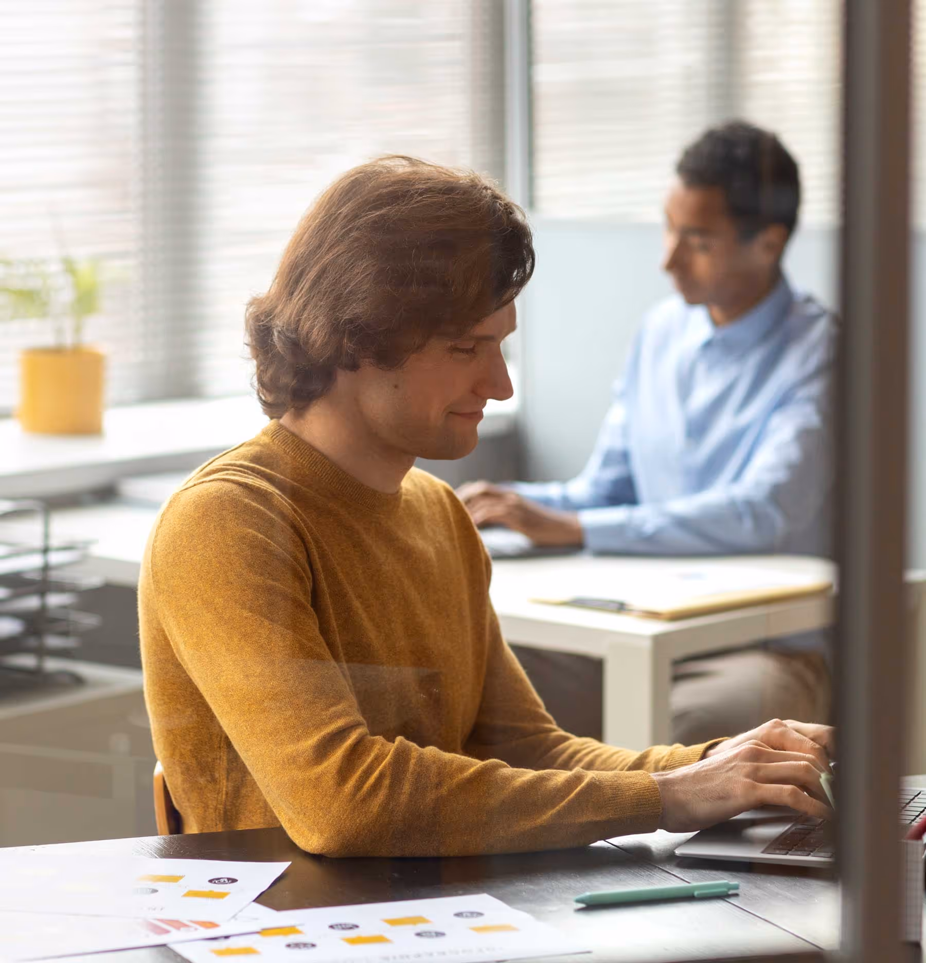 A photo of people working in computers.