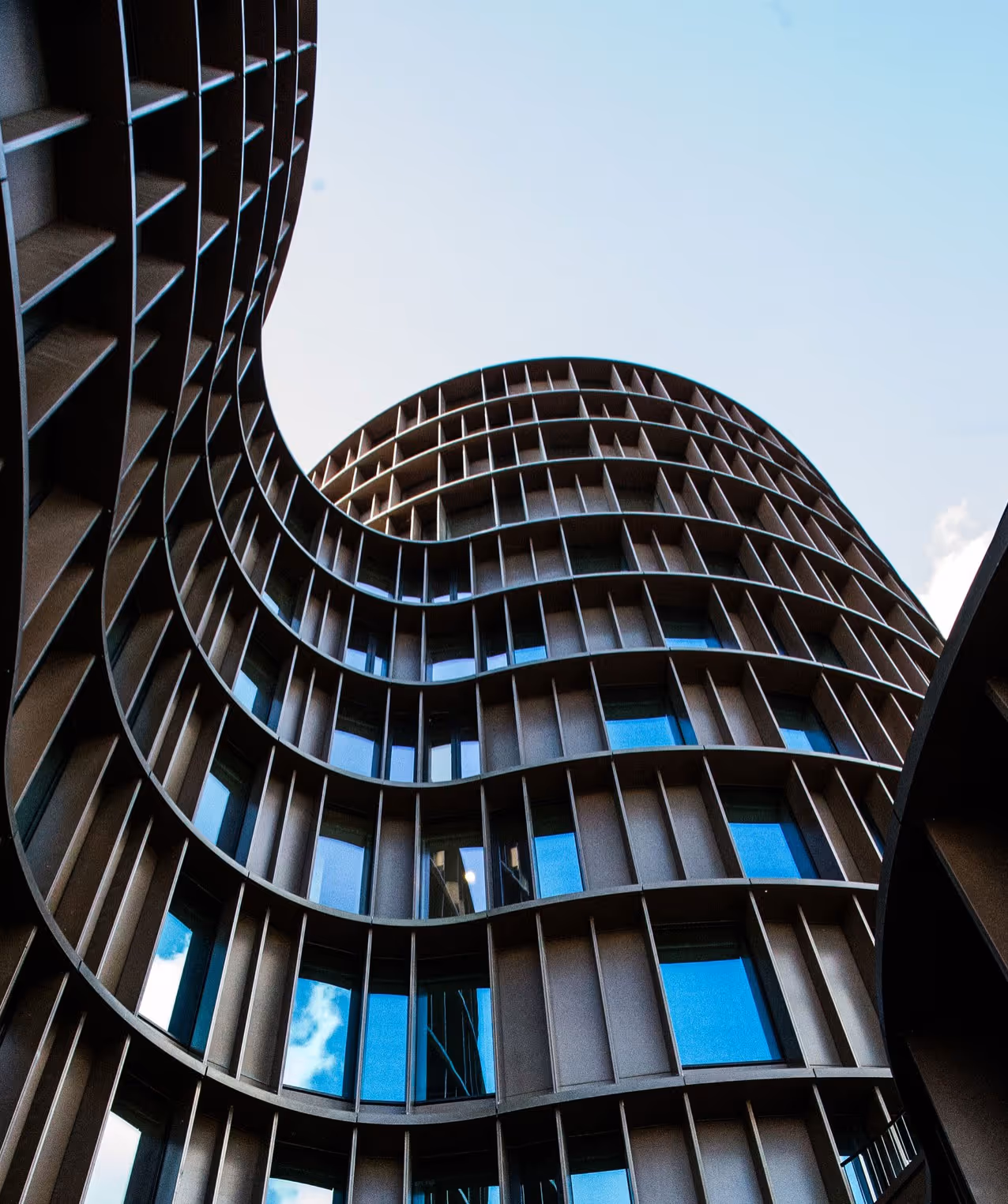 A picture of a modern building from below.