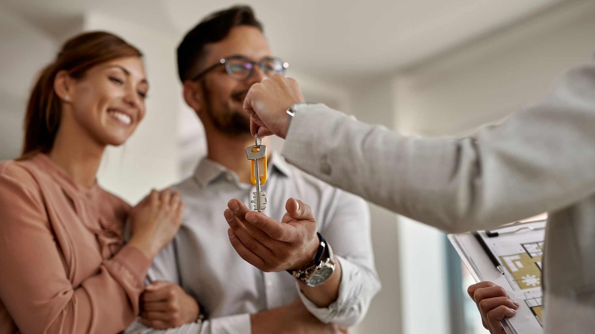 Image of a couple buying their first house.