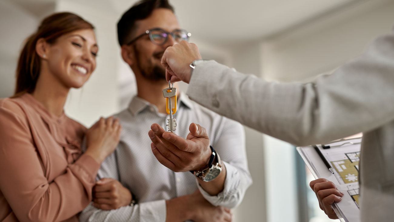 Image of a couple buying their first house.