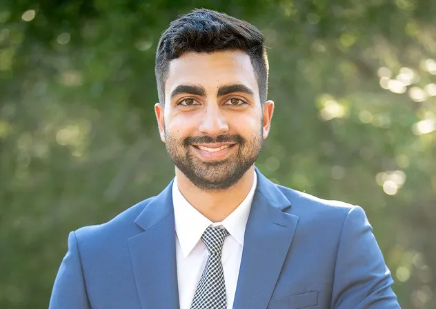 Headshot of a man in a suit