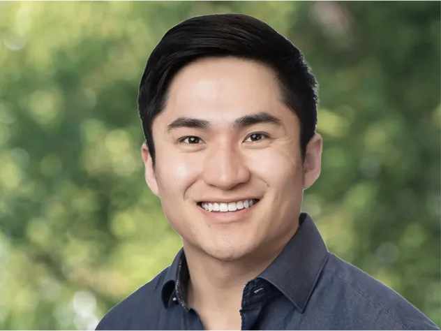 Headshot of a man in a collared shirt