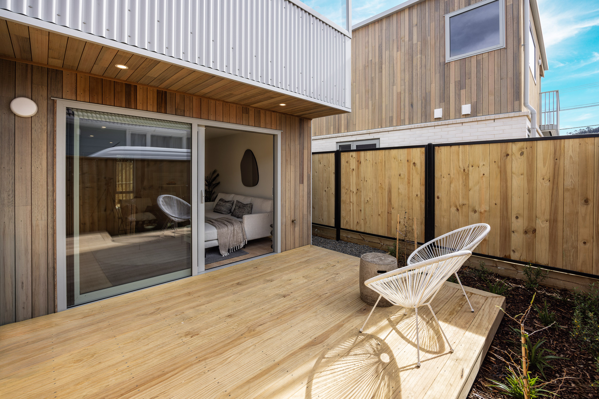 Private ground-level deck opening off the living room
