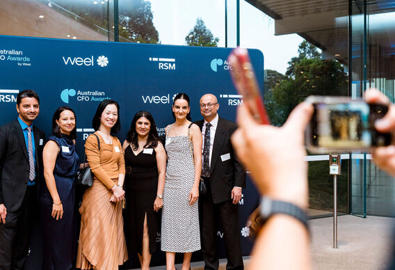 A group of guests photographed together on arrival