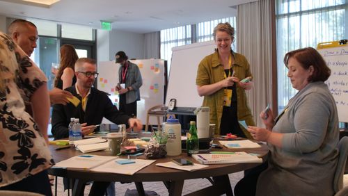 Emily Fanjoy facilitating a group meeting and workshop.