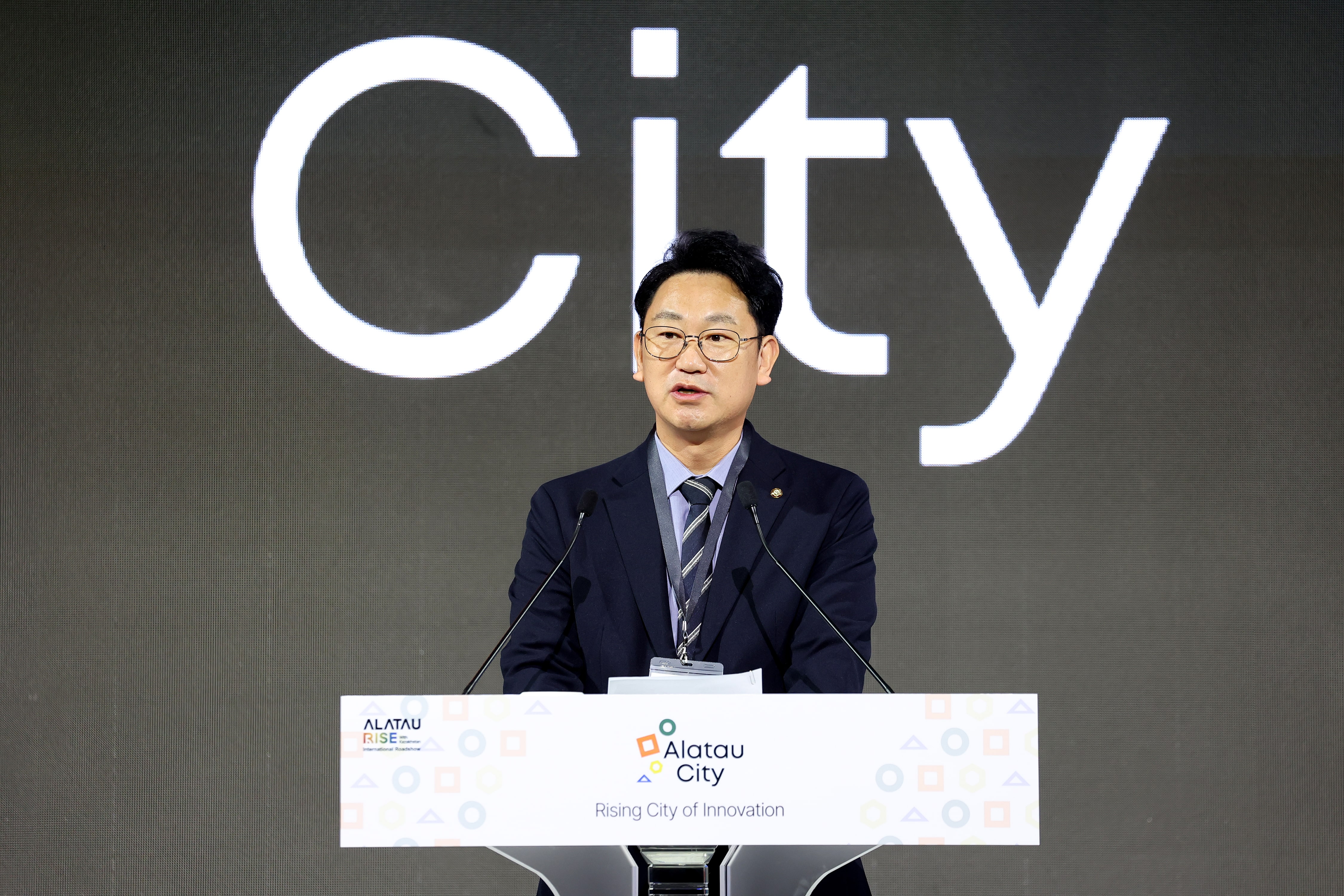 The Fact: Kwak Sang Eon Representative of the Democratic Party of Korea delivers a congratulatory speech at the ‘Alatau City’ International Roadshow