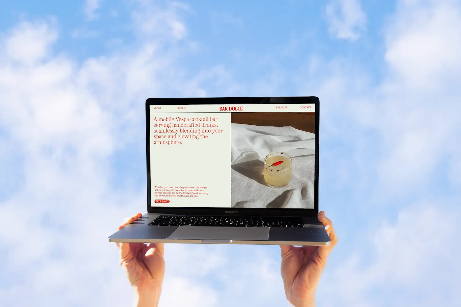 Bar Dolce Bar Service Newcastle website design on laptop with blue sky background