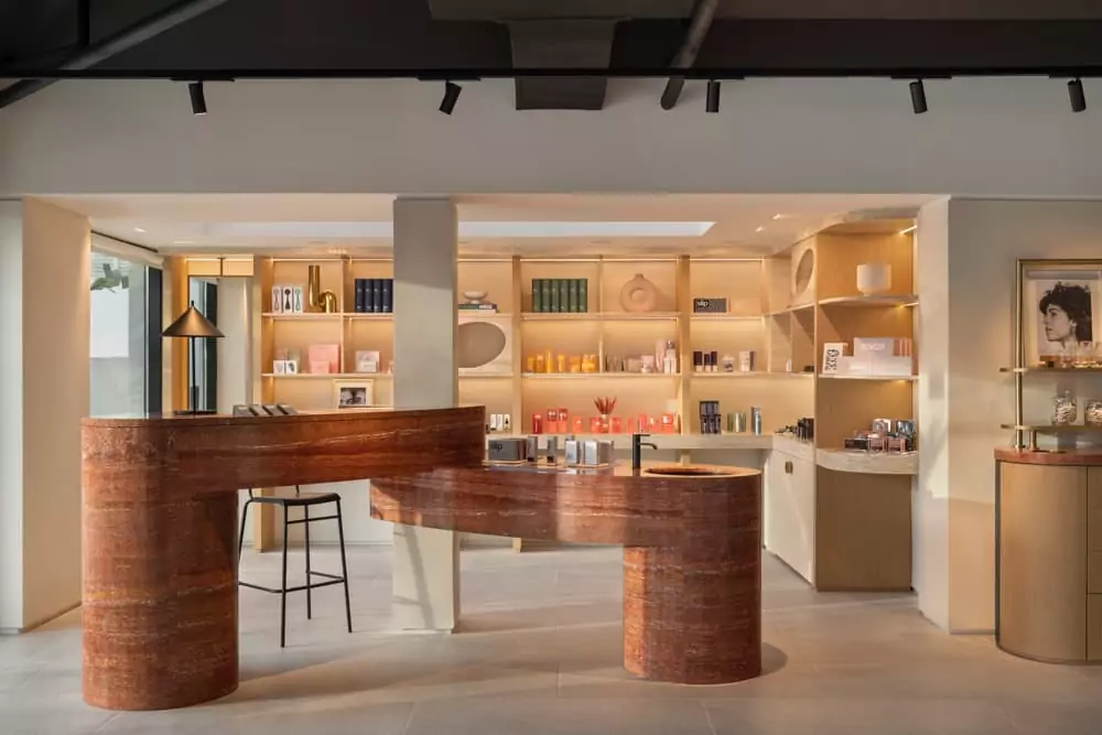 A large open kitchen with a bar in the middle of it.