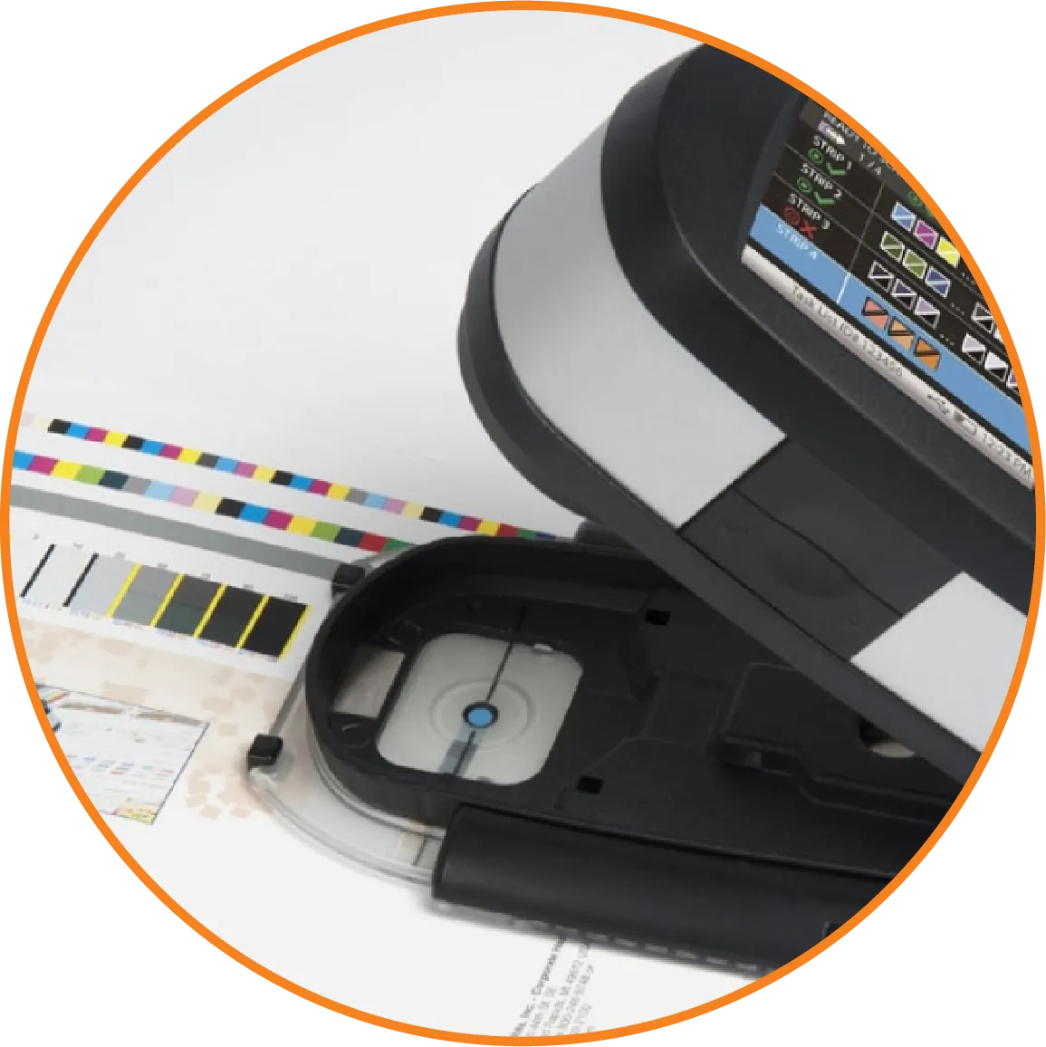 Color calibration device scanning a test print with color bars and swatches.