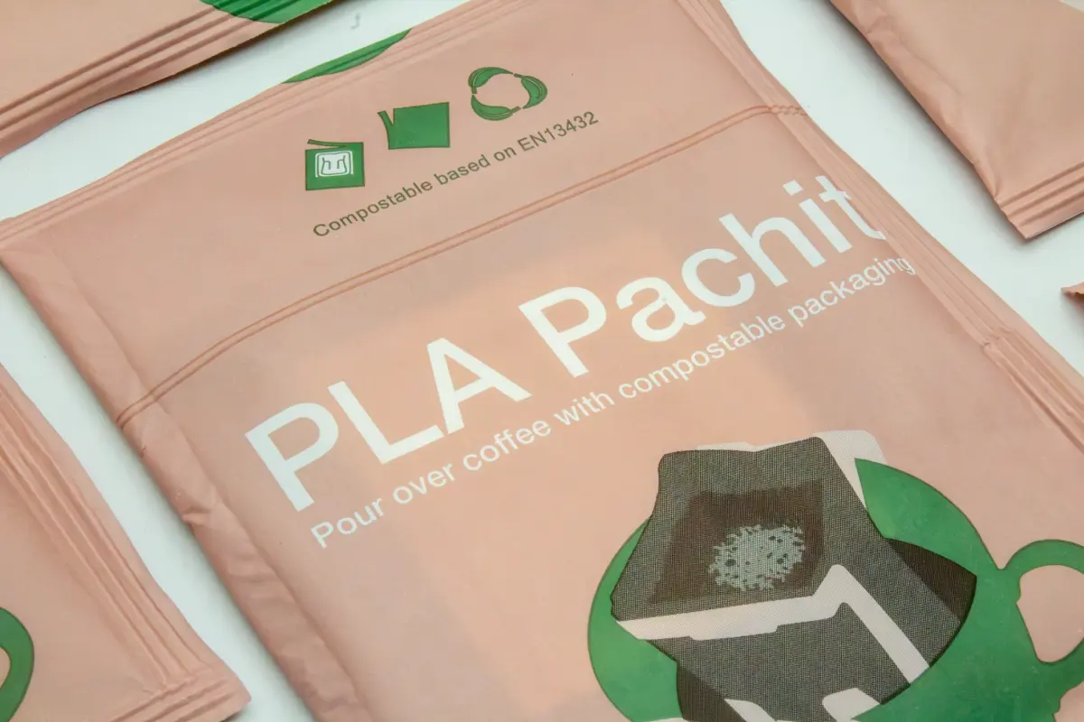 Paper PLA compostable flow pack sachet designed for pour-over coffee.