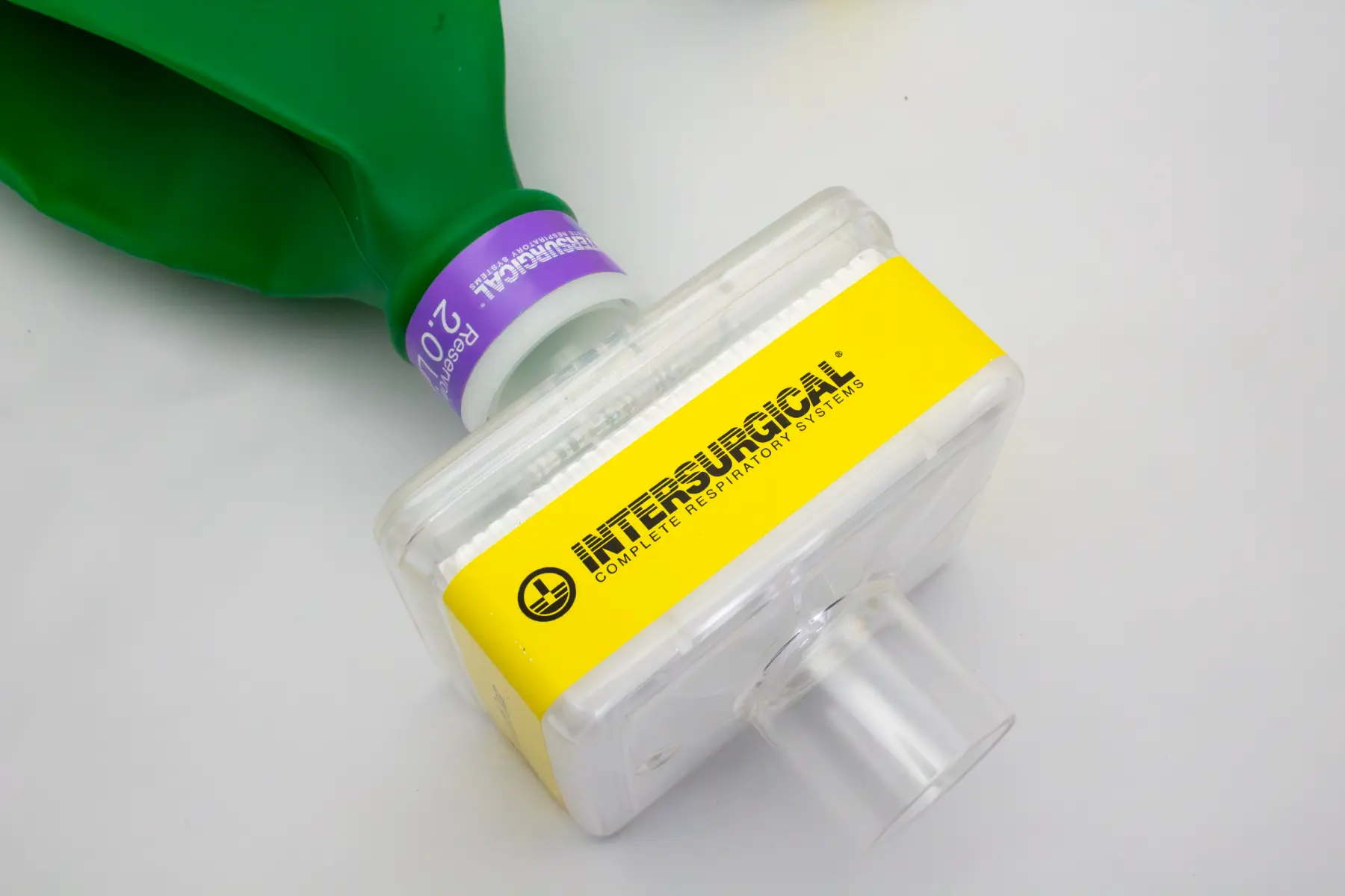High-durability yellow adhesive label applied to a medical respiratory device for secure identification.