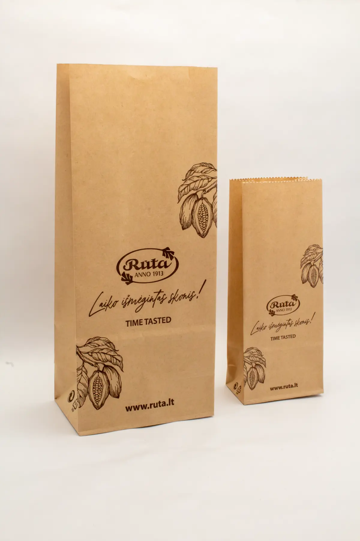Custom printed brown kraft block bottom bags for confectionery brand Rūta.