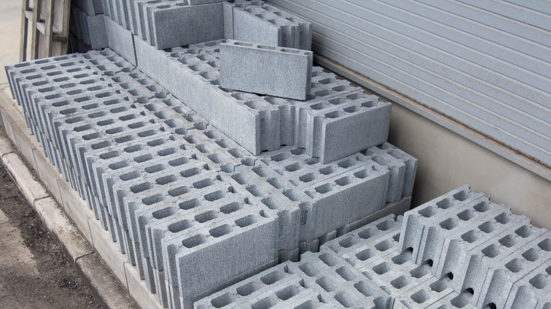 Cleanly stacked white building bricks – construction materials featured in Enke’s circular inventory