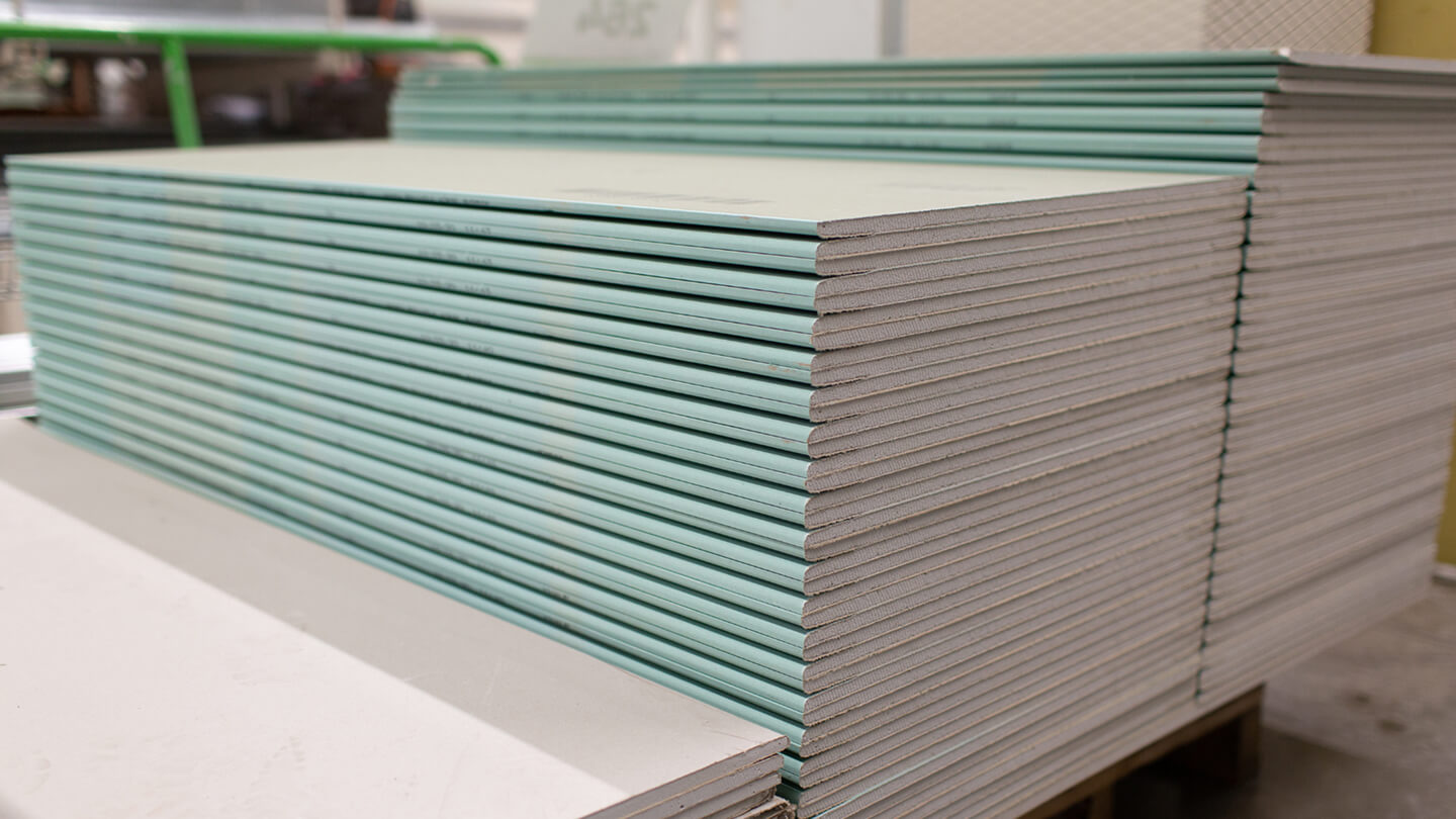 Neatly stacked drywall panels – reclaimed building materials prepared for resale through Enke