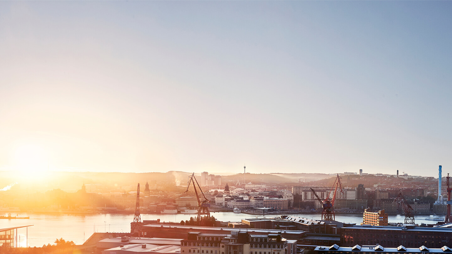 Sunrise over industrial harbor cityscape – symbolizing climate transparency with EPD Generator