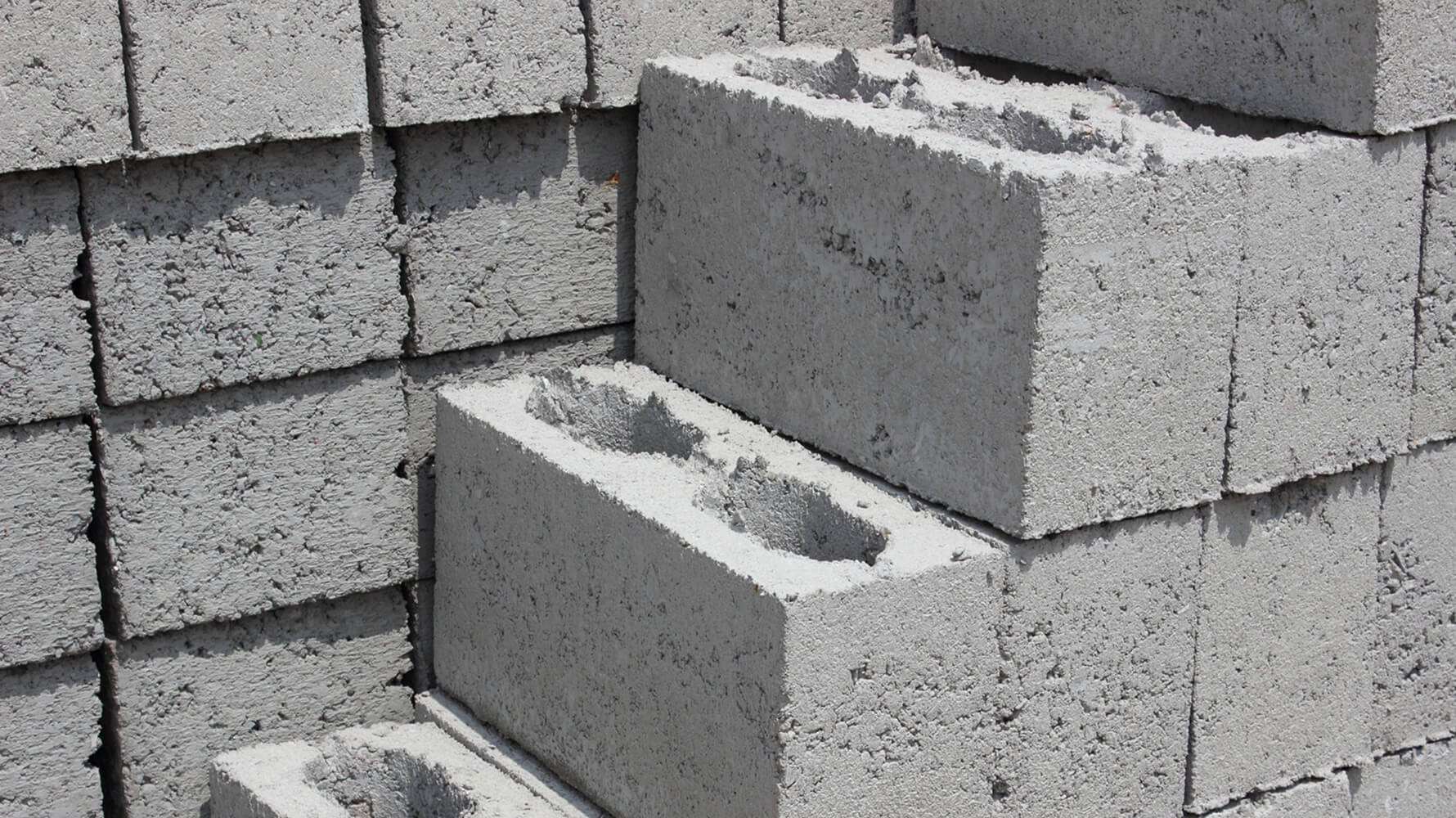 Minimalist white wall panel with subtle surface texture – representing prefab materials in need of verified climate declarations