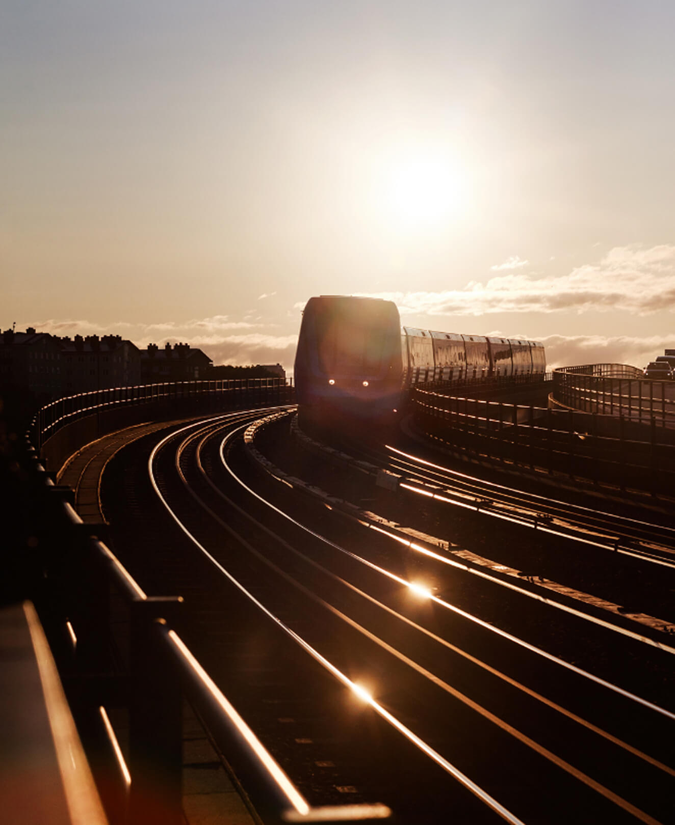 Train approaching camera at sunset – visualizing the future of digital railway monitoring