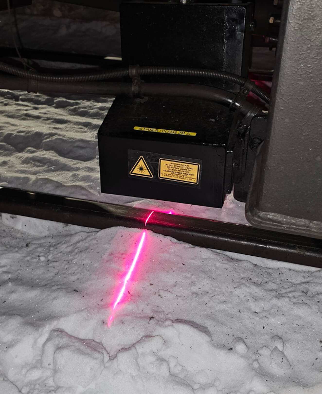 Close-up of QTMS sensor on rail track – high-precision hardware for advanced railway diagnostics