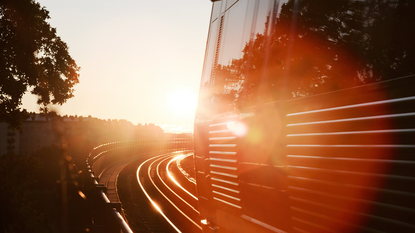 Sunrise over railway tracks – symbolizing the shift toward sustainable and proactive rail maintenance