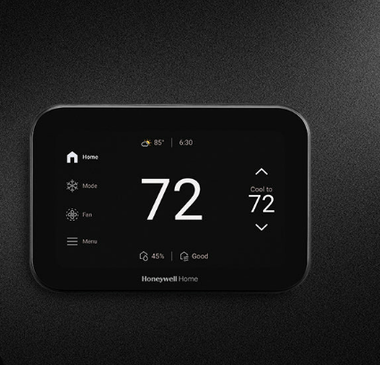 Digital thermostat screen showing heating set to 72 degrees.