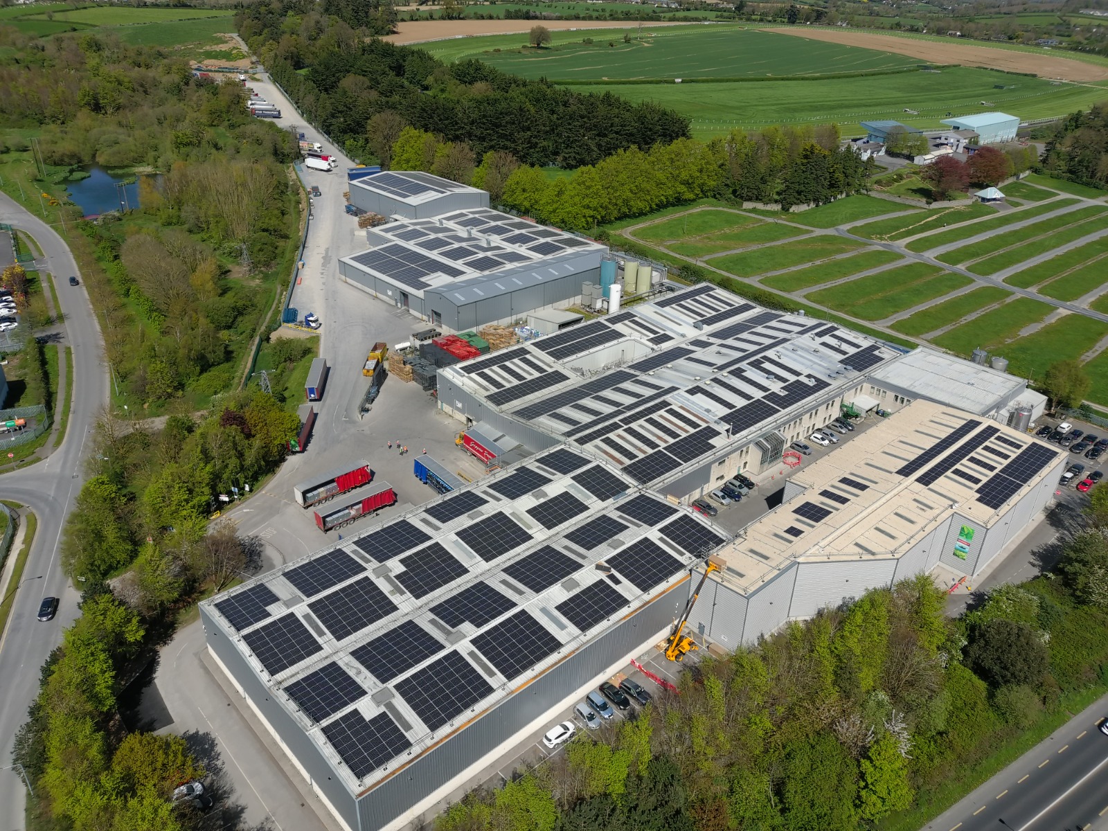 Aerial view of Glenpatrick Water facility with extensive rooftop solar panel installation