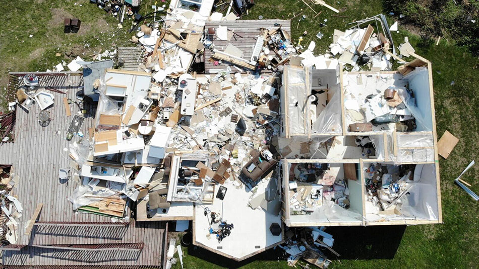 Aerial photo showing weather-related damage to building.