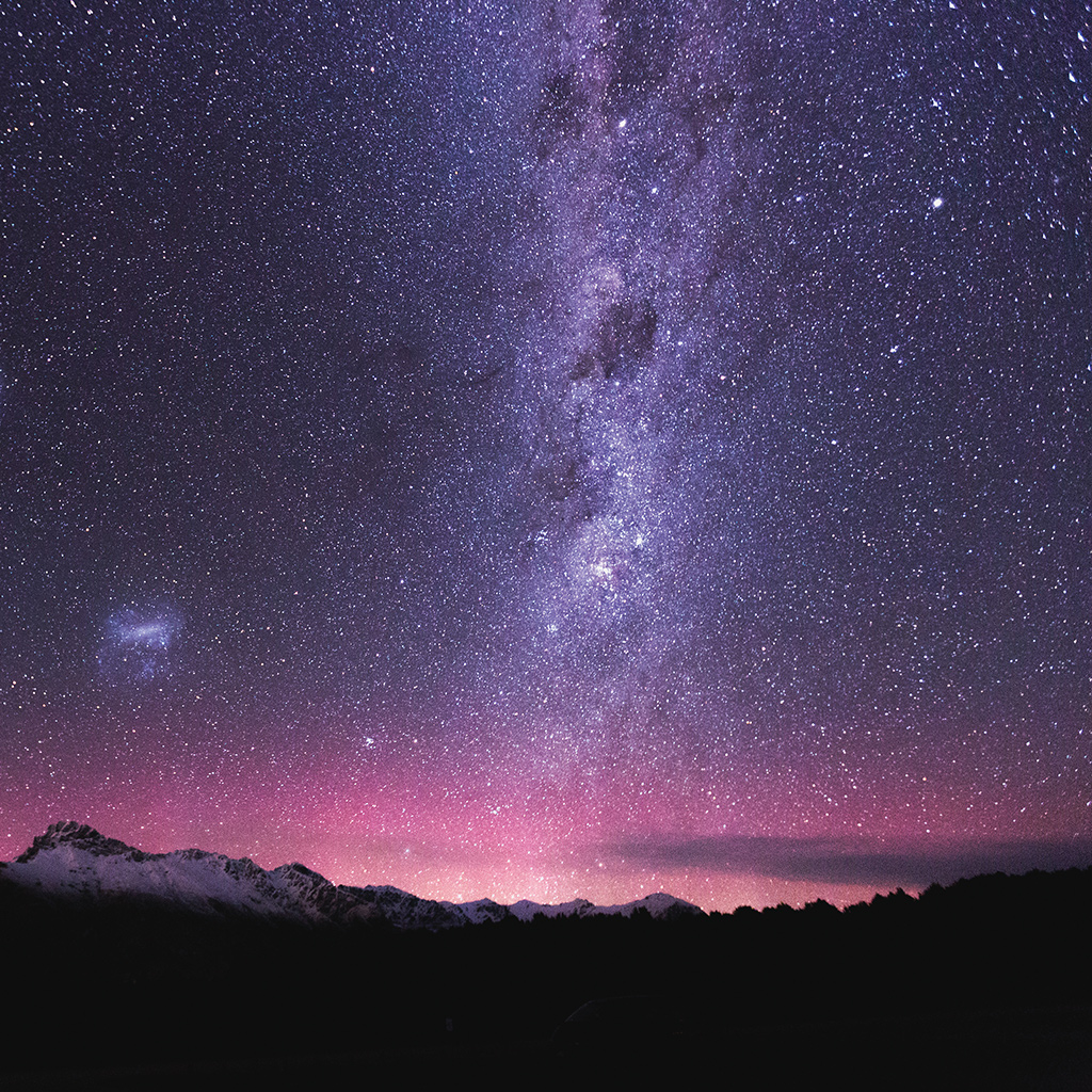 Night sky with mountains and a sky full of stars.