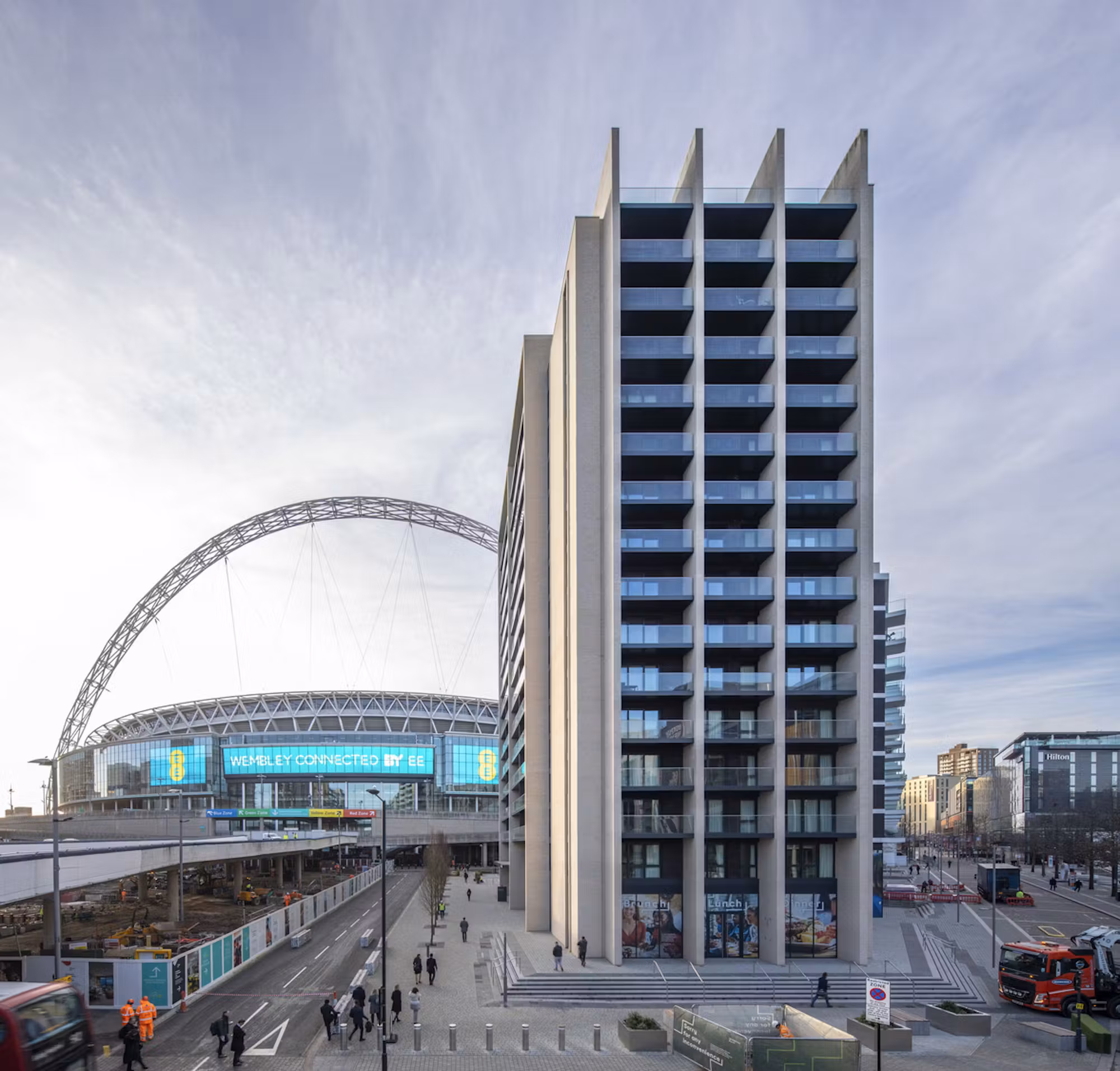 Residential tower at Wembley Park with Wembley Stadium's arch behind