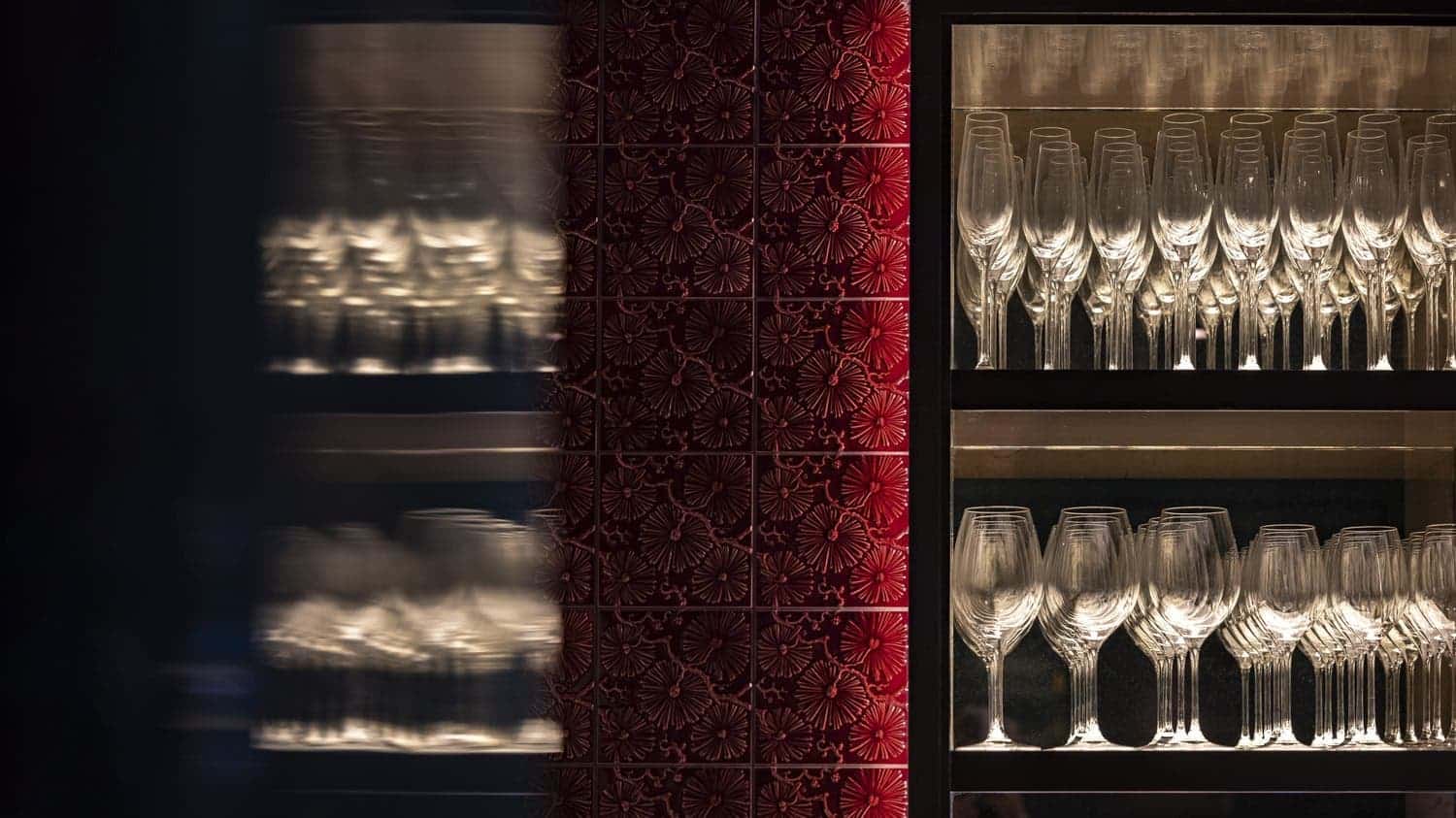 Wine glasses on backlit shelving in the bar at Beaverbrook Town House