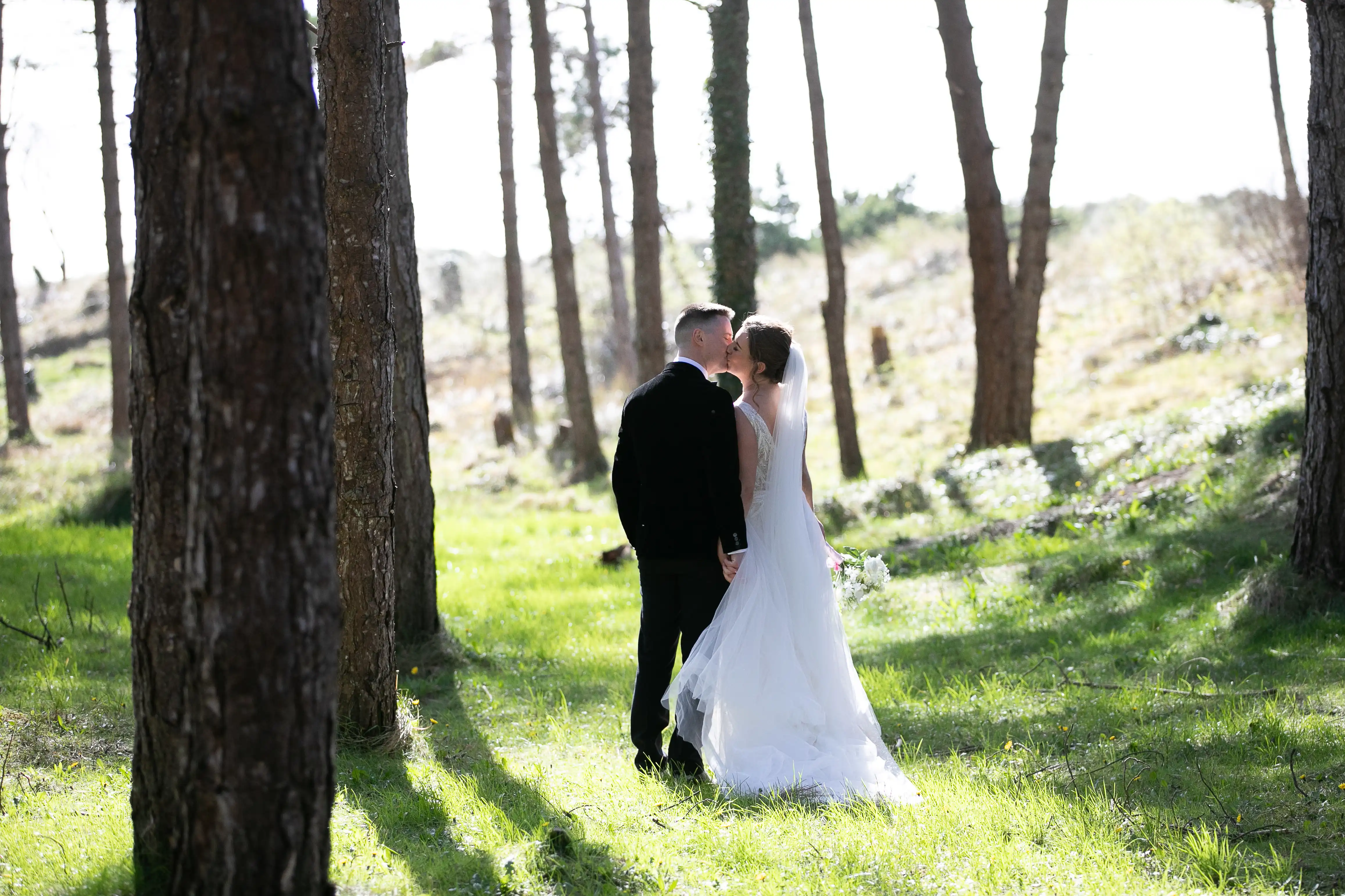 Couple kissing in the forest