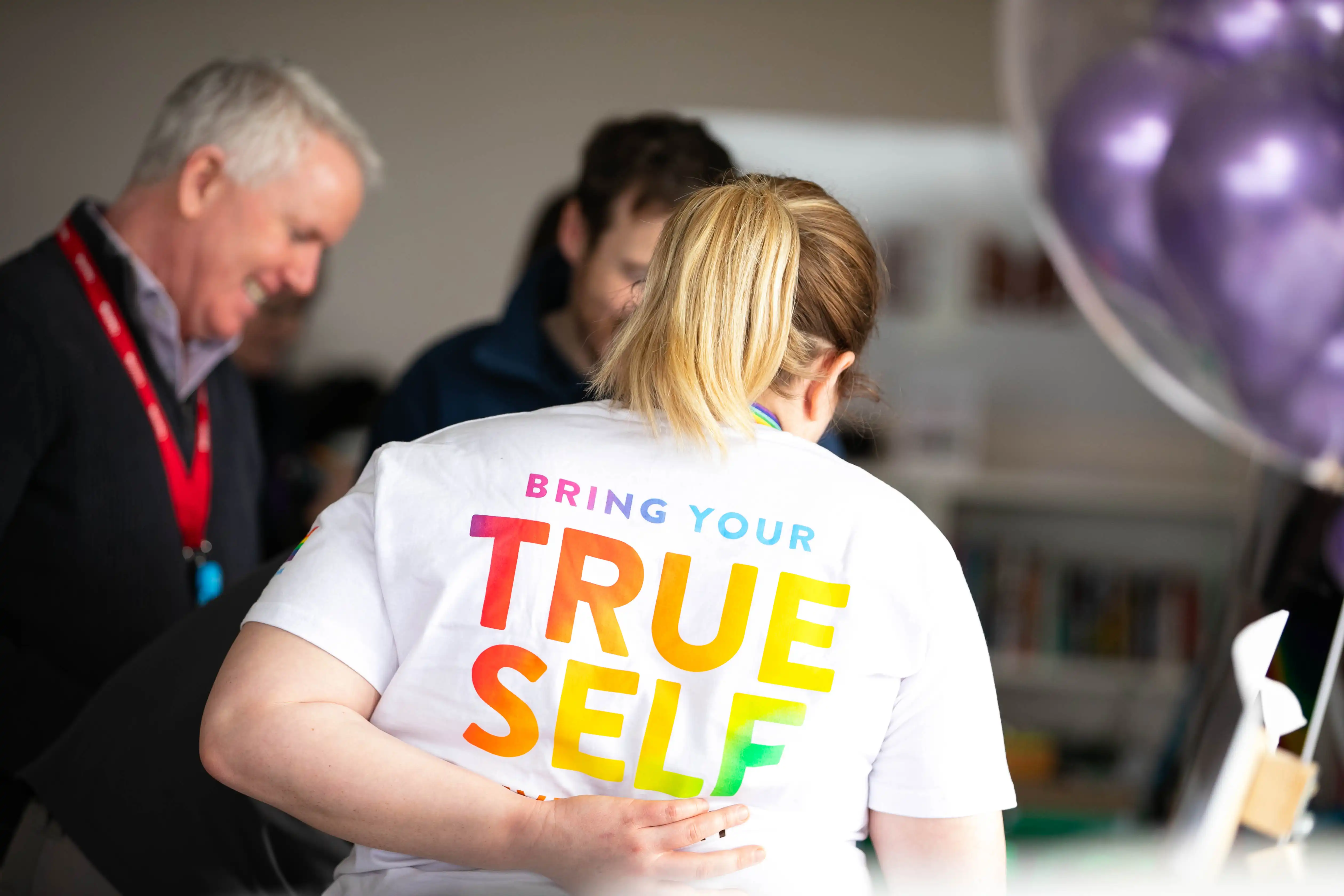 Lady wearing t-shirt with phrase "Bring Your True Self"