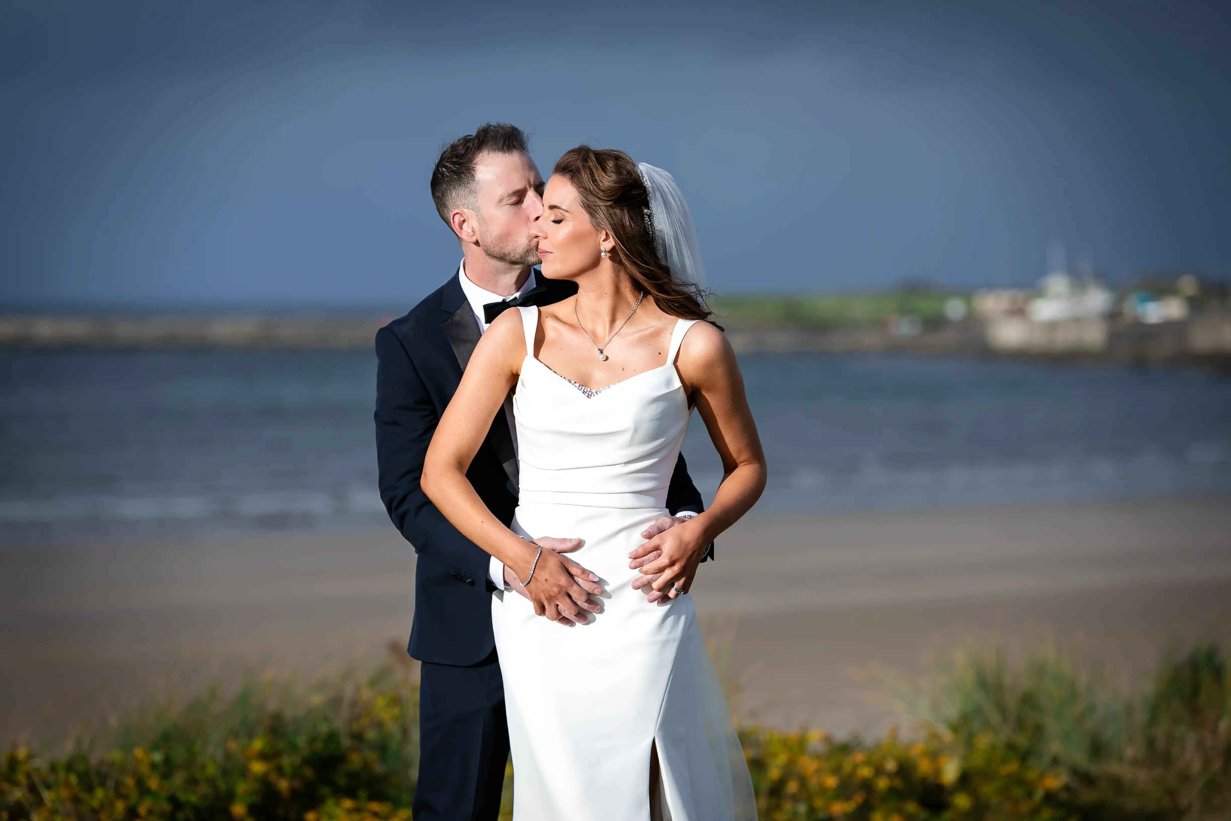 Groom kissing bride