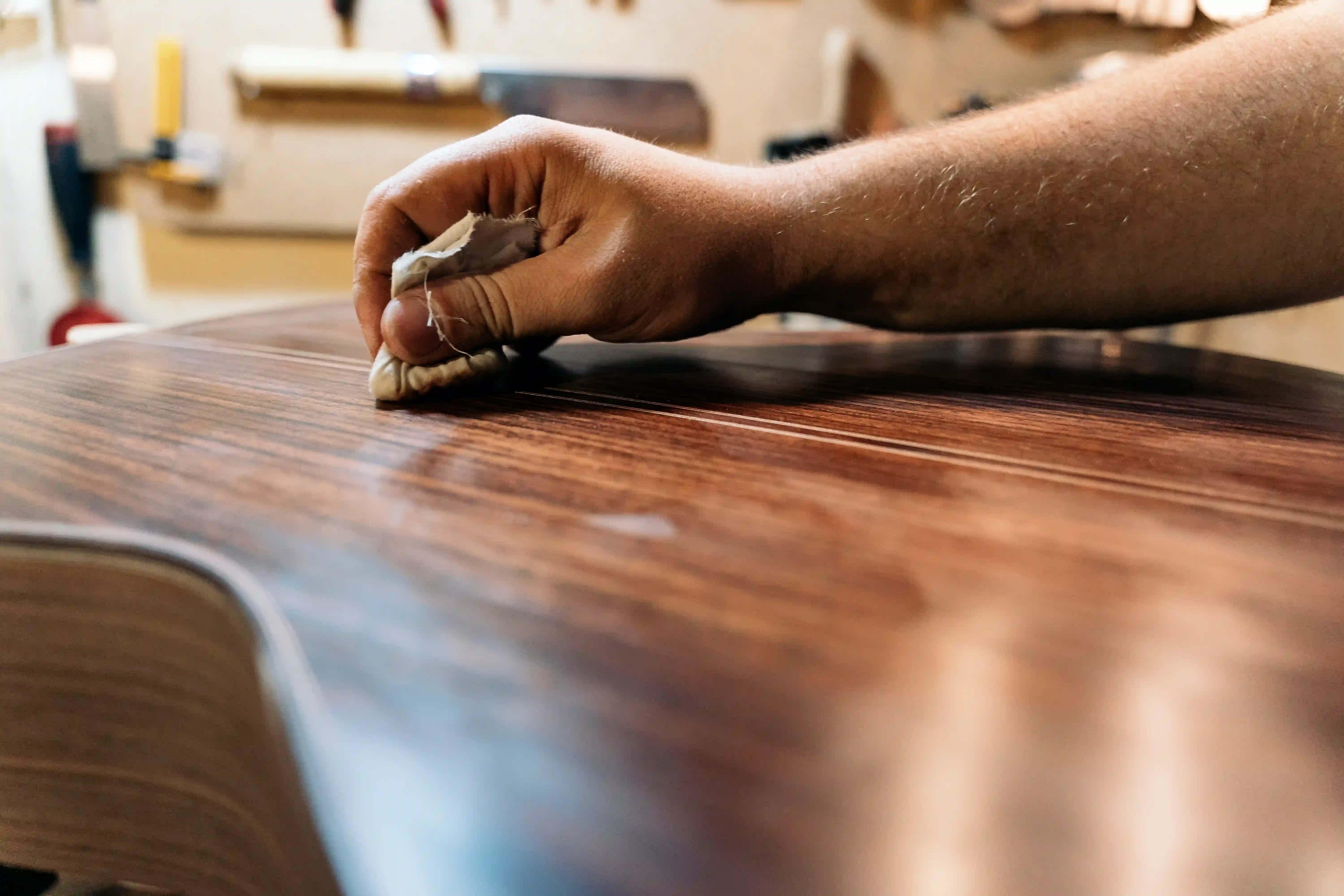 close up of hand working on hardwood plank