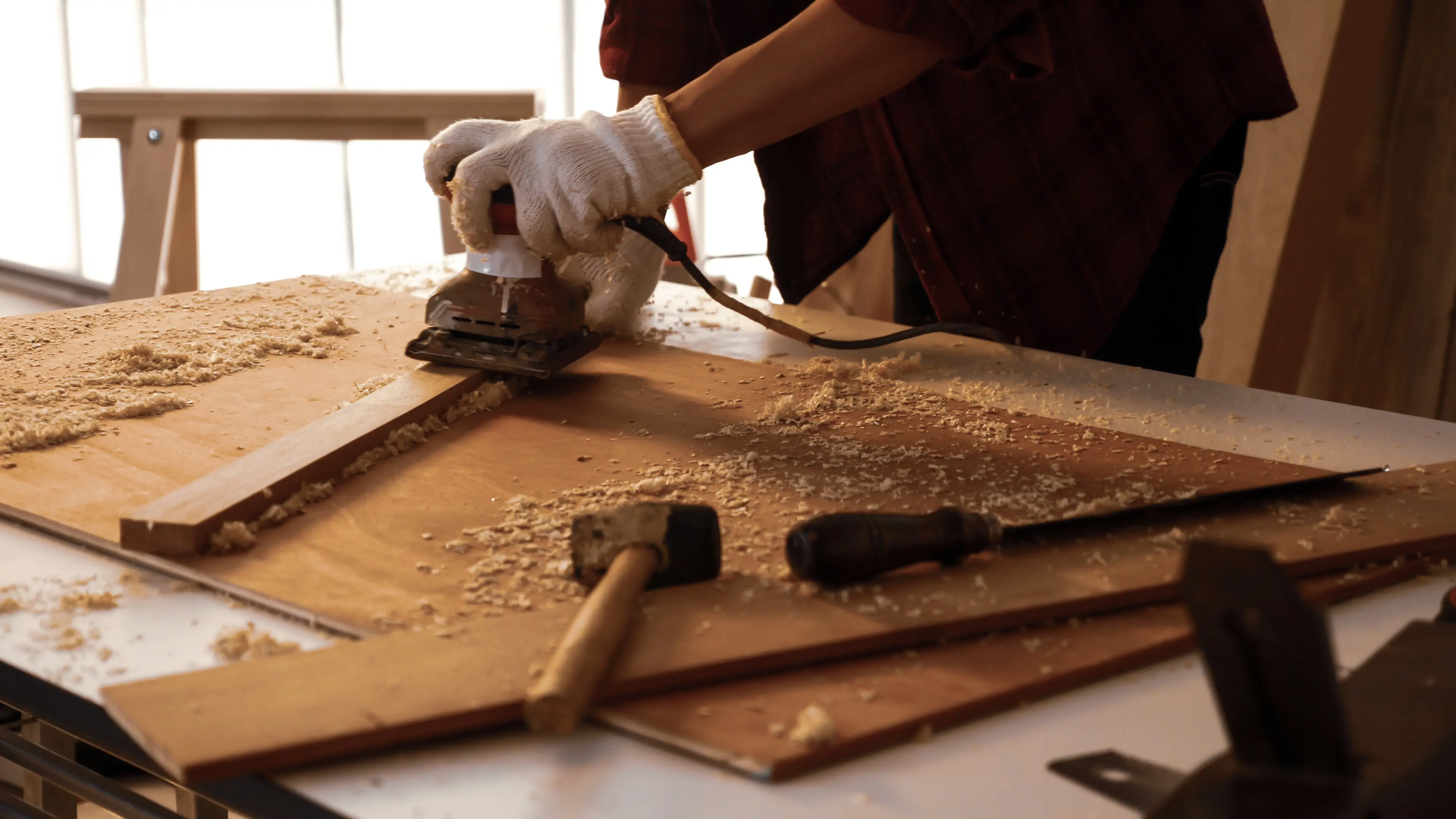 carpenter using tools to work on project