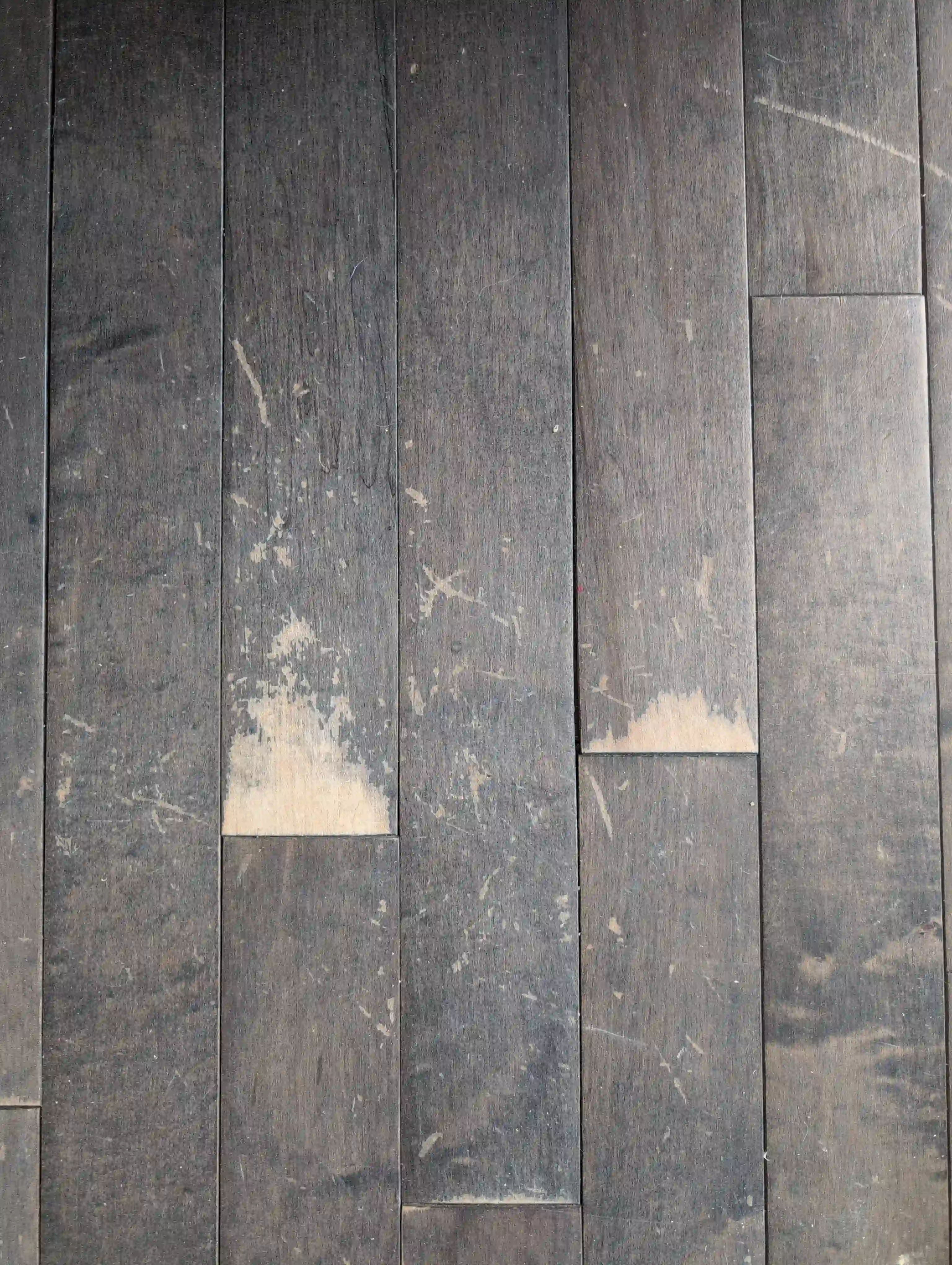 scuffed dark hardwood flooring