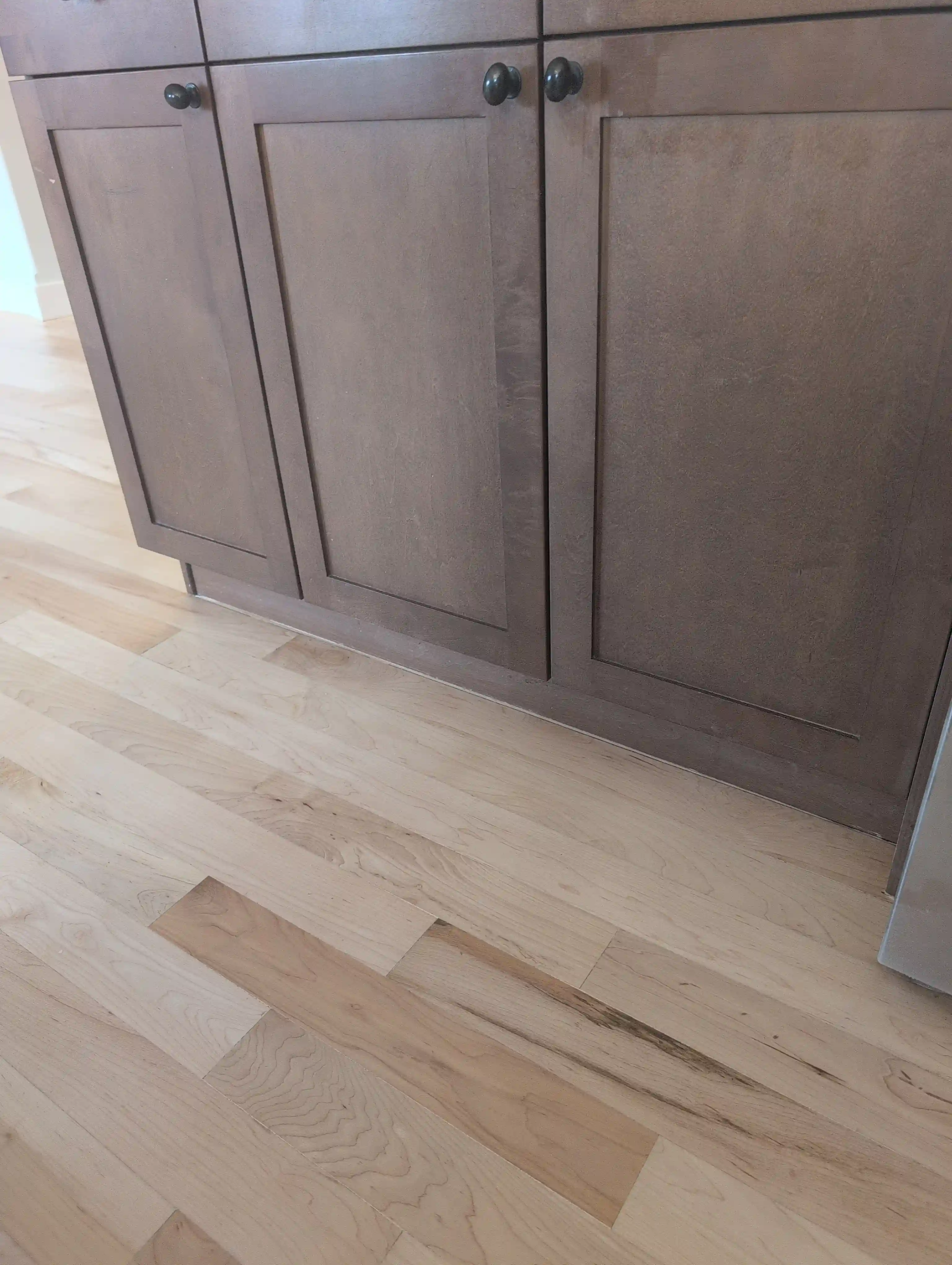 light hardwood in front of kitchen island