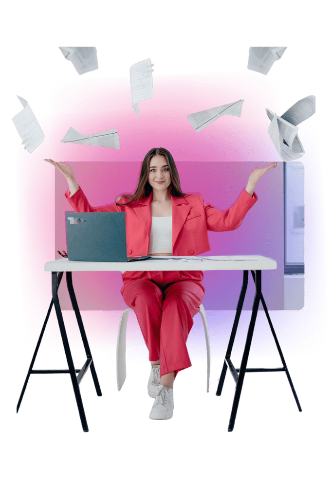 Wiktoria Chojcan siedzi przy biurku z laptopem w czerwonym garniturze, rozrzucając dokumenty w powietrzu – symbol efektywnej organizacji nauki i pracy studentów z wykorzystaniem AI